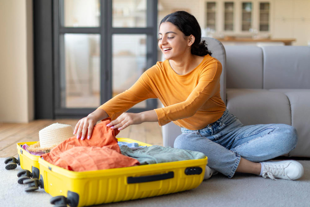 A woman packing a suitcase